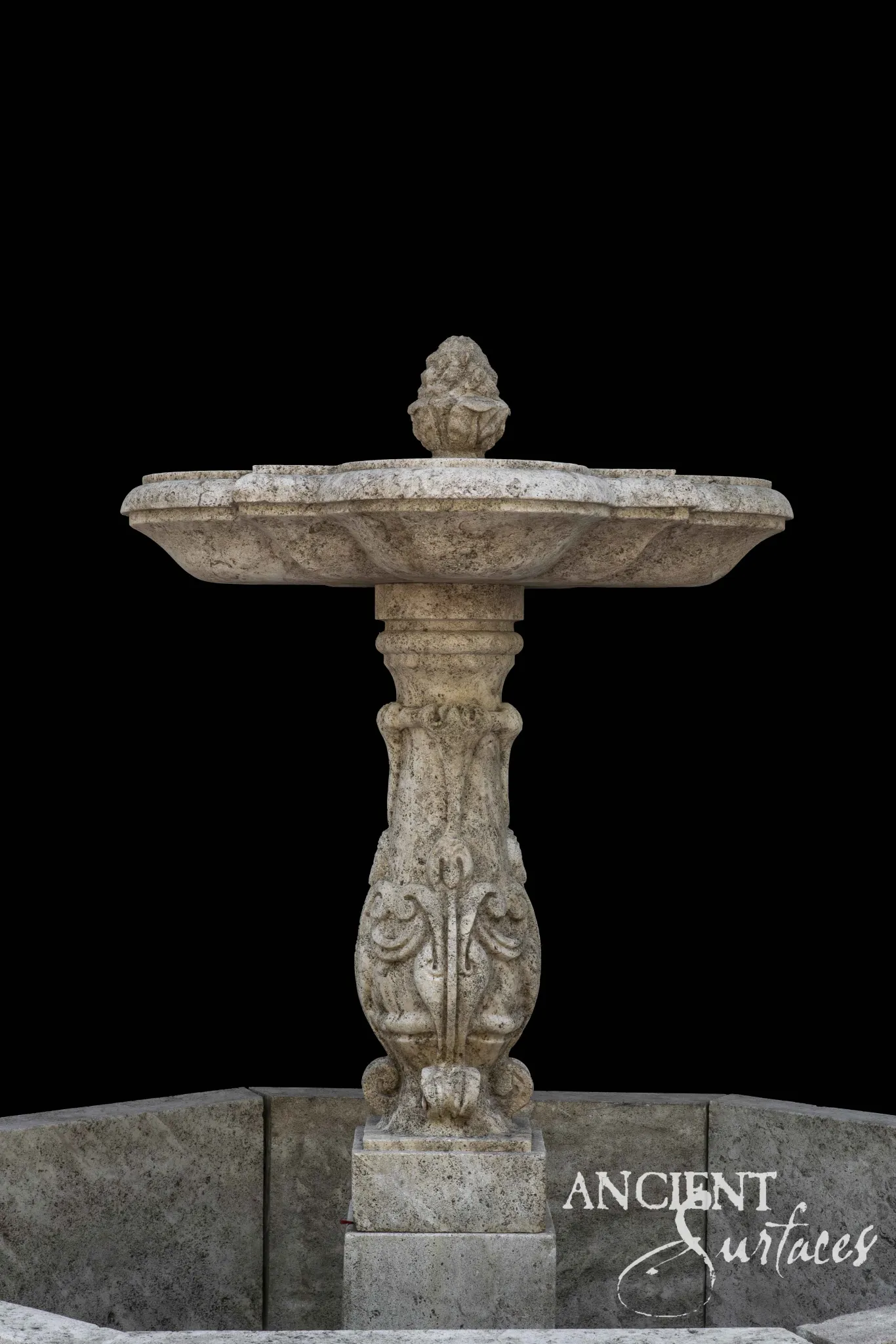 Ancient Surfaces reclaimed limestone fountain bowl carved with acanthus volutes beneath a quatrefoil lip and pinecone finial