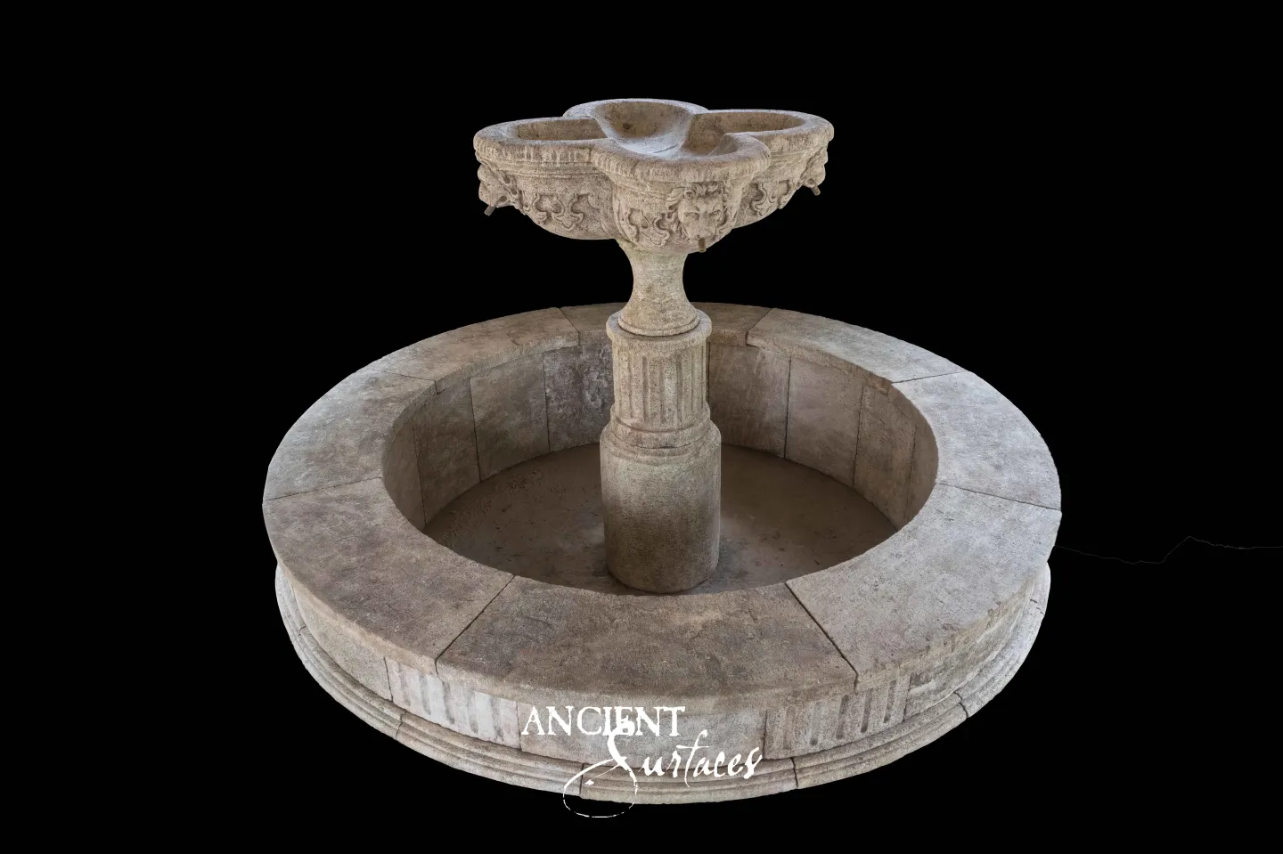 Ancient Surfaces reclaimed round limestone fountain with a carved trefoil lion head bowl on a fluted column