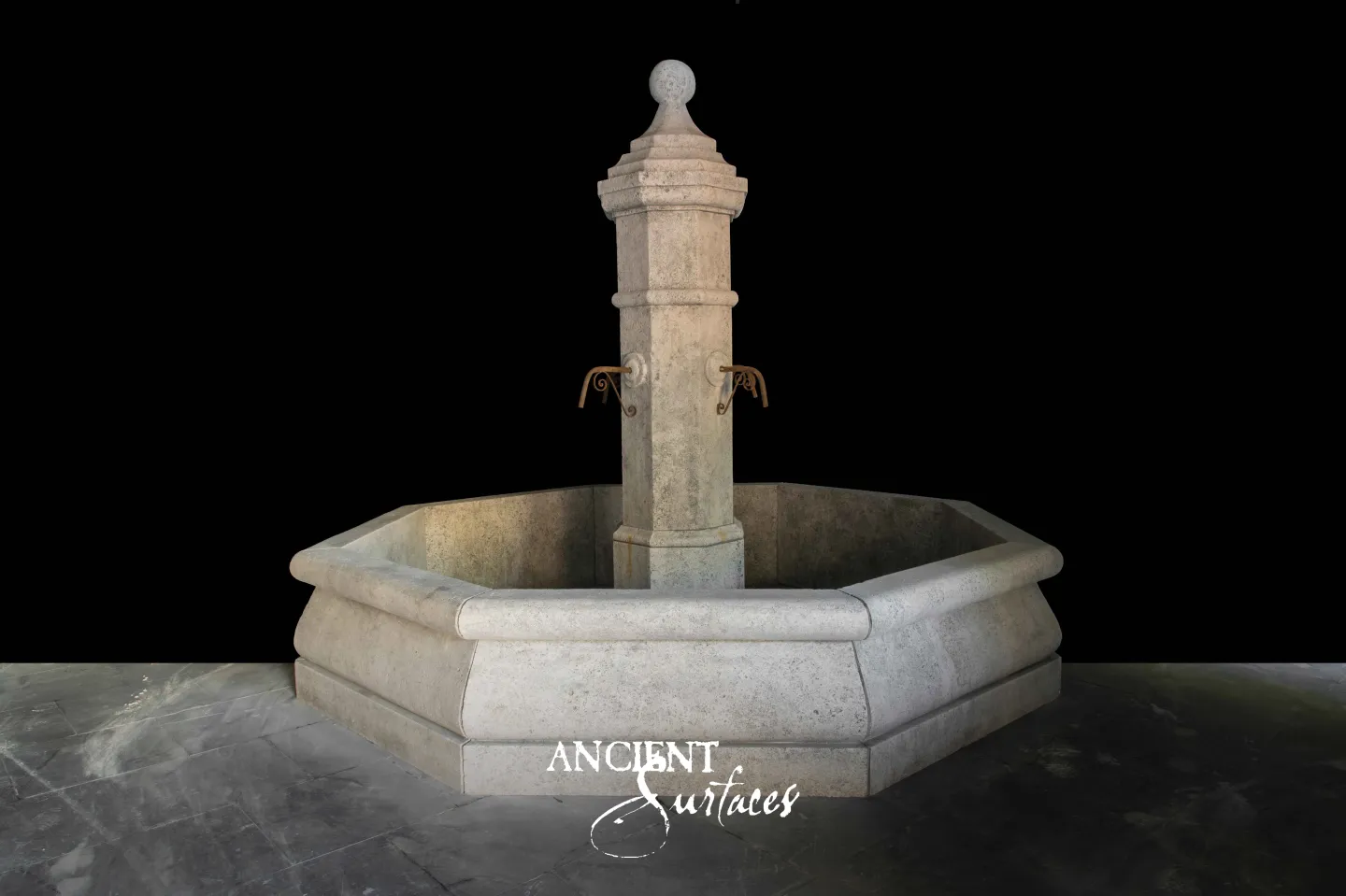 Reclaimed octagonal limestone fountain from Ancient Surfaces with a ball finial pillar and two brass scroll water spouts